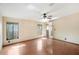 Spacious bedroom with wood-look floors and natural light from two windows at 12519 Cambridge Ave, Tampa, FL 33624