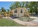 A charming home with a brick walkway, fenced yard, and well-maintained landscaping at 12519 Cambridge Ave, Tampa, FL 33624