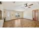 Living room featuring wood-look floors, and a front door with an oval window at 12519 Cambridge Ave, Tampa, FL 33624