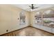 Light-filled living room with beautiful laminate wood flooring at 12519 Cambridge Ave, Tampa, FL 33624