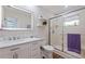Modern bathroom with marble countertop, updated vanity, toilet and a glass enclosed shower at 137 11Th E St, Tierra Verde, FL 33715