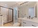 Bright bathroom with updated vanity, shower, and tile flooring at 137 11Th E St, Tierra Verde, FL 33715