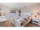 Bright bedroom with floral accents, white furniture, and carpeted floor at 137 11Th E St, Tierra Verde, FL 33715