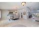 Bright and airy dining area showcasing a glass table, seating for six, and seamless flow to the adjacent living spaces at 137 11Th E St, Tierra Verde, FL 33715