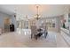 A large dining room features stylish furniture, elegant lighting, and ample space for entertaining guests at 137 11Th E St, Tierra Verde, FL 33715