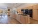 Modern kitchen with wood cabinets, stainless appliances, and a center island with cooktop at 137 11Th E St, Tierra Verde, FL 33715