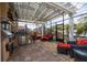 Screened lanai with an outdoor kitchen, comfortable seating, and a view of the water at 137 11Th E St, Tierra Verde, FL 33715