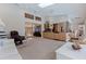 Spacious living room featuring light wood cabinets, a ceiling fan, and an open floor plan at 137 11Th E St, Tierra Verde, FL 33715