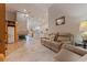 Cozy living room with stone fireplace, hardwood floors, and comfortable leather seating at 137 11Th E St, Tierra Verde, FL 33715