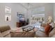 Spacious living area featuring a vaulted ceiling, modern decor, and a seamless transition to the adjacent spaces at 137 11Th E St, Tierra Verde, FL 33715