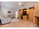 Cozy living room with wood floors, built-in cabinets, and a fireplace at 137 11Th E St, Tierra Verde, FL 33715