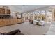 Open-concept living area with large windows overlooking the backyard, featuring light wood cabinets at 137 11Th E St, Tierra Verde, FL 33715