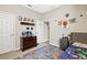 Fun bedroom with a themed decor, a dresser, and a cozy bed at 1435 Montgomery Bell Rd, Wesley Chapel, FL 33543