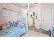 Bright bedroom featuring a white canopy bed and a collection of stuffed animals at 1435 Montgomery Bell Rd, Wesley Chapel, FL 33543
