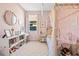 Charming bedroom features a canopy bed, vanity, bookshelves, and a cozy, carpeted space at 1435 Montgomery Bell Rd, Wesley Chapel, FL 33543