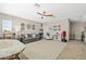 Spacious bonus room with a ceiling fan, neutral walls, and carpet floors, perfect for Gathering entertainment at 1435 Montgomery Bell Rd, Wesley Chapel, FL 33543