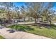 Fenced dog park with a gazebo, seating, and play area for pets in a community at 1435 Montgomery Bell Rd, Wesley Chapel, FL 33543