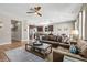 Spacious living room features hardwood floors, a ceiling fan, and an open floor plan at 1435 Montgomery Bell Rd, Wesley Chapel, FL 33543