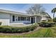 Charming single-story home featuring a manicured lawn, mature shrubbery, and a welcoming entrance at 1465 40Th Ne Ave, St Petersburg, FL 33703