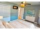 Cozy bedroom with ensuite bathroom features a closet and dresser, providing comfort and convenience at 1509 Lemon St, Clearwater, FL 33756