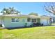 Charming single-story home with well-manicured lawn, complemented by tidy landscaping at 1509 Lemon St, Clearwater, FL 33756