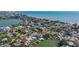 Stunning aerial view of a waterfront home with direct access to the Gulf of Mexico and private boat dock at 15904 Redington Dr, Redington Beach, FL 33708
