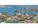 Scenic aerial view of the property's neighborhood on canals with open water views and access at 15904 Redington Dr, Redington Beach, FL 33708
