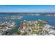 Breathtaking aerial view highlighting the waterfront property with easy access to the Gulf and nearby city at 15904 Redington Dr, Redington Beach, FL 33708