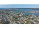 Panoramic aerial perspective capturing the neighborhood's canals, homes, and proximity to the ocean at 15904 Redington Dr, Redington Beach, FL 33708