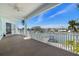 Water view from a spacious balcony with white railing, looking towards the water at 15904 Redington Dr, Redington Beach, FL 33708