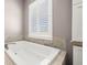 Close up view of bathtub and window at 15904 Redington Dr, Redington Beach, FL 33708