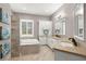 Luxurious bathroom with dual vanity, soaking tub, and separate shower at 15904 Redington Dr, Redington Beach, FL 33708