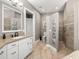 Stylish bathroom with dual sinks, walk-in shower, and modern fixtures at 15904 Redington Dr, Redington Beach, FL 33708