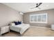 Comfortable bedroom featuring neutral tones, shutters, and ample natural light at 15904 Redington Dr, Redington Beach, FL 33708