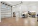 Large garage with epoxy flooring, work benches, and ample storage options at 15904 Redington Dr, Redington Beach, FL 33708