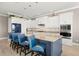 Modern kitchen with stainless steel appliances, stylish cabinetry, and a large center island with seating at 15904 Redington Dr, Redington Beach, FL 33708