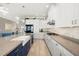 Well-appointed kitchen with granite countertops, stainless steel appliances, and ample cabinet space at 15904 Redington Dr, Redington Beach, FL 33708