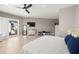 Bedroom featuring modern ceiling fan, hardwood floors, and access to balcony at 15904 Redington Dr, Redington Beach, FL 33708