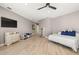 Spacious main bedroom featuring wood floors and a modern ceiling fan at 15904 Redington Dr, Redington Beach, FL 33708