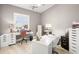 Office space with two desks, filing cabinets, and a bright window with shade at 15904 Redington Dr, Redington Beach, FL 33708