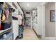 Organized walk-in closet with custom shelving, drawers, and hanging space at 15904 Redington Dr, Redington Beach, FL 33708