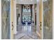 Elegant foyer with soaring ceilings, grand staircase, and abundant natural light at 16205 Sierra De Avila, Tampa, FL 33613