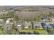This home features an aerial view with a screened pool and serene water views at 18823 Wimbledon Cir, Lutz, FL 33558