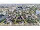 Aerial view of a home near a lake, tennis courts, clubhouse, and community amenities at 18823 Wimbledon Cir, Lutz, FL 33558