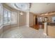 Bright breakfast nook with bay windows and a view into the living room and kitchen areas at 18823 Wimbledon Cir, Lutz, FL 33558