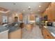 Spacious kitchen featuring granite countertops, stainless steel appliances, and a breakfast island at 18823 Wimbledon Cir, Lutz, FL 33558