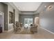 Spacious living room with fireplace, tray ceiling, and sliding glass doors to the lanai at 18823 Wimbledon Cir, Lutz, FL 33558