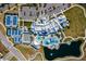 Aerial view of a community clubhouse with tennis courts, pool, and parking at 19206 Ship Wheel Way, Land O Lakes, FL 34638