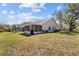 Spacious backyard with a screened patio, perfect for outdoor relaxation and entertainment at 2345 Bentley Dr, Palm Harbor, FL 34684