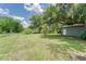 Spacious backyard with shed and expansive lawn at 2708 De Montmollin Rd, Plant City, FL 33565